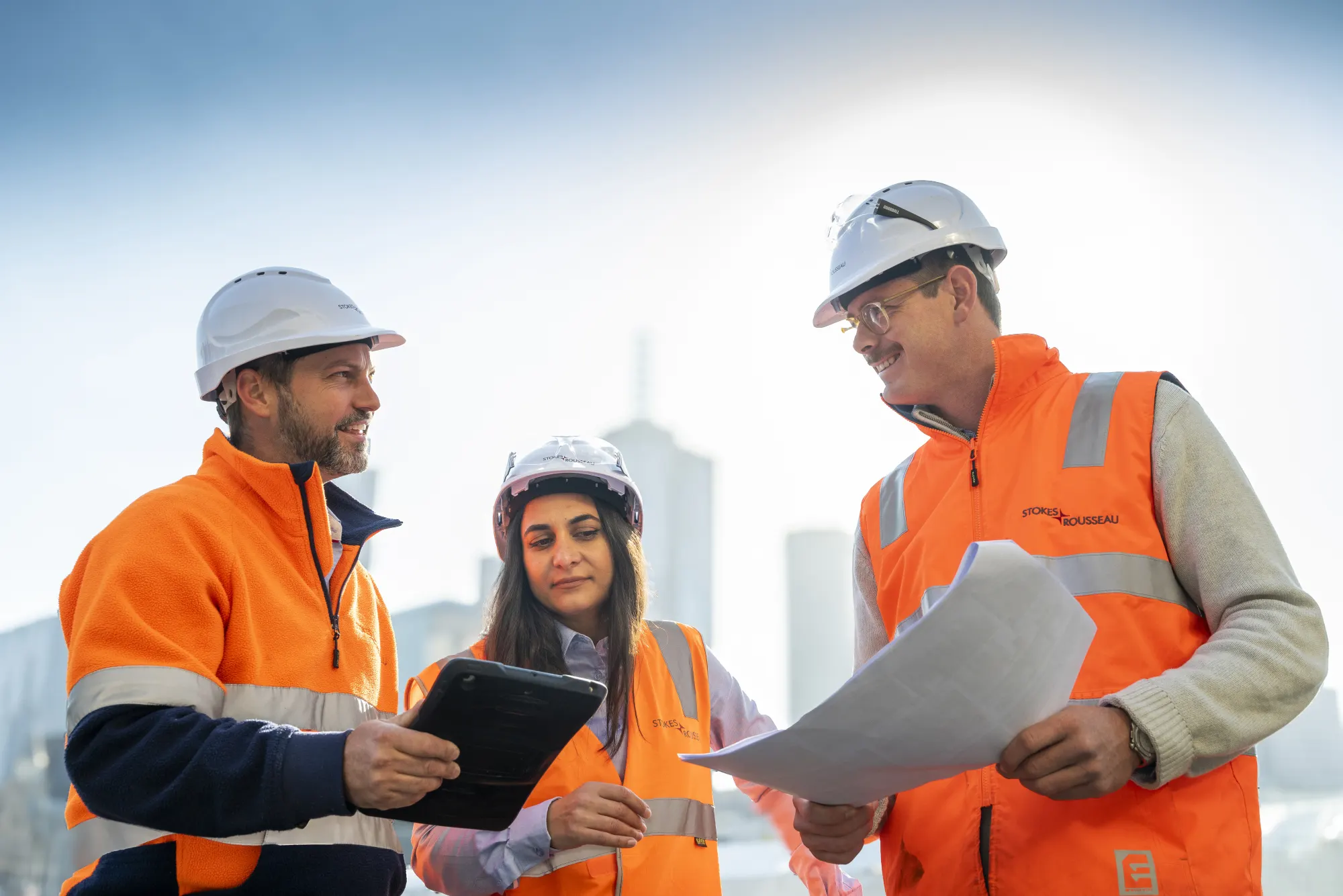 Stokes team reviewing project plans during a site briefing