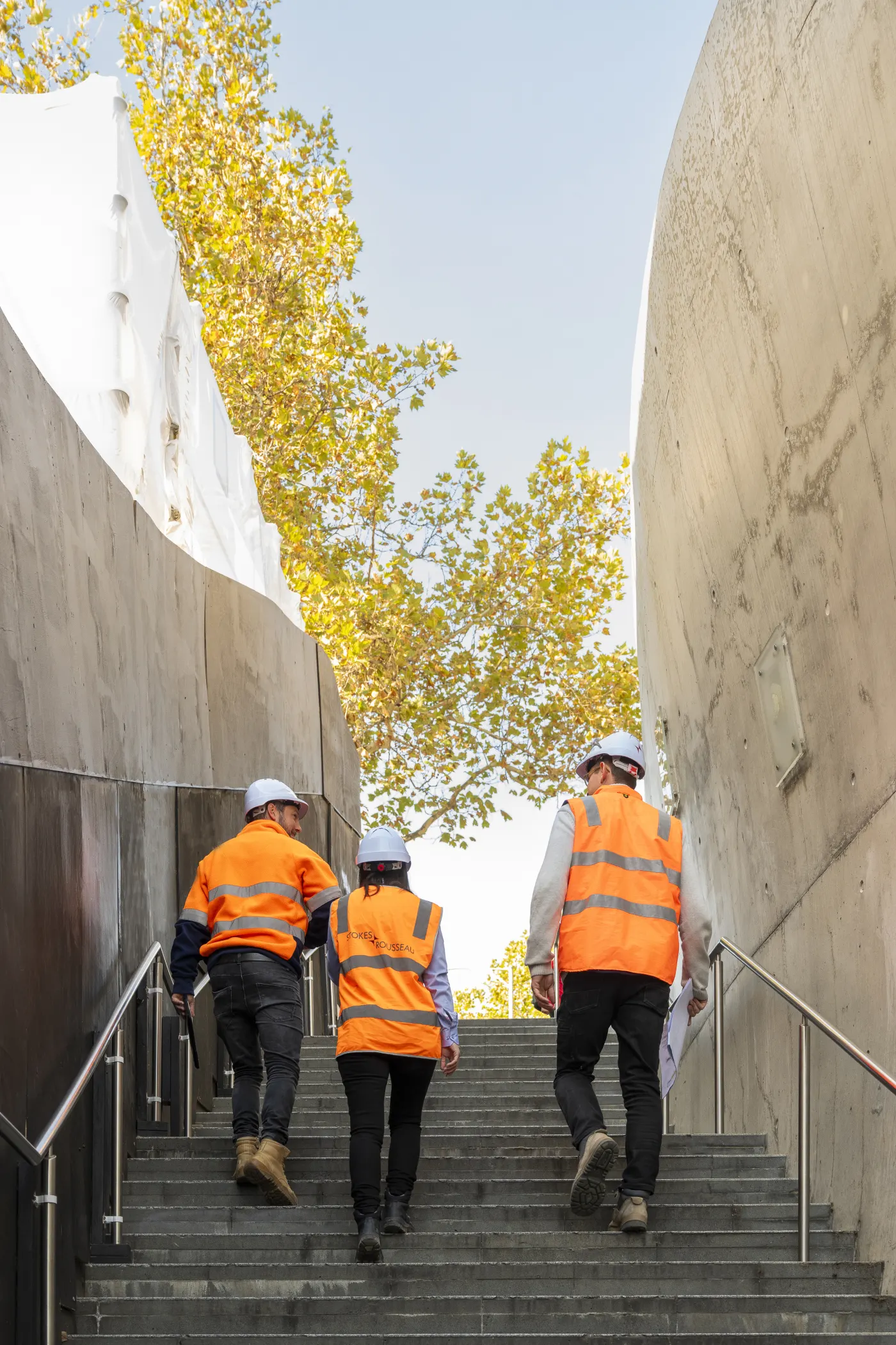 Stokes team members walking through a construction site